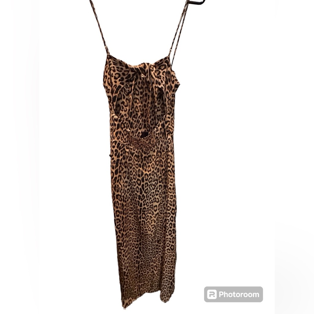 Leopard print dress ties in back, buttons on side. Perfect for a wedding or date